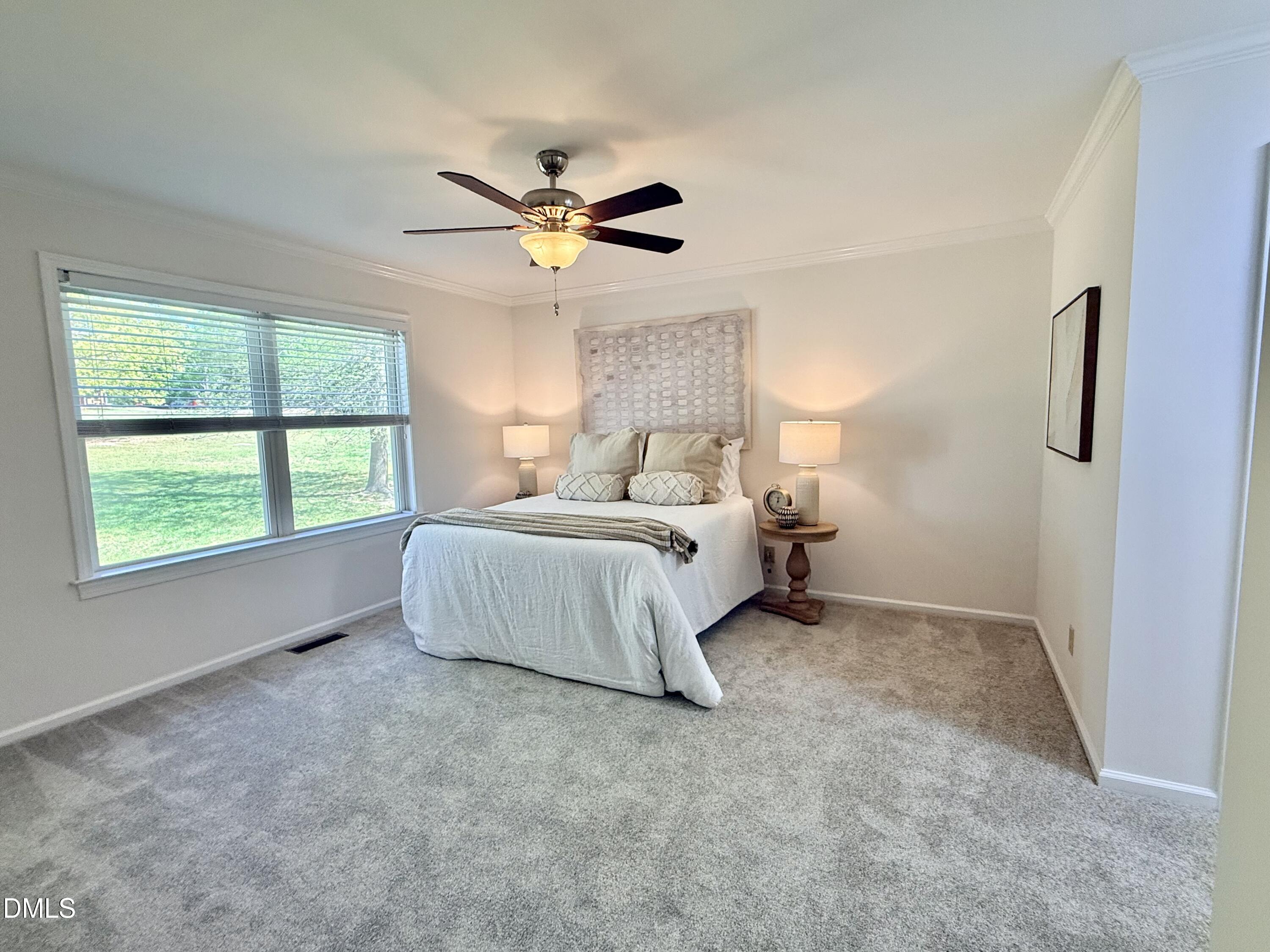 2429 Halifax Road Roxboro, NC 27573 - Photo 24 of 54 a bedroom with a bed and a window