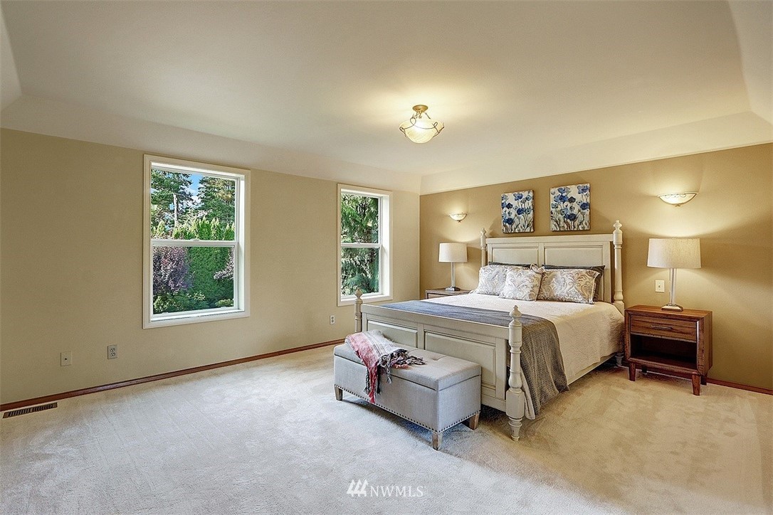 220 174th Street Southwest Bothell, WA 98012 - Photo 16 of 35 a bedroom with a bed and a night stand