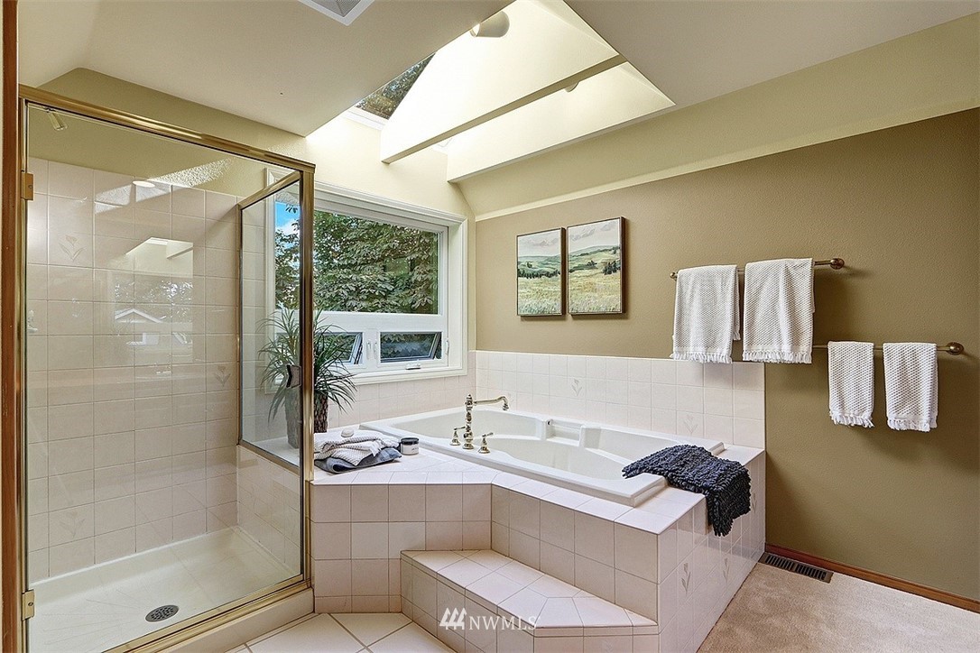 220 174th Street Southwest Bothell, WA 98012 - Photo 18 of 35 a bathroom with a tub sink and mirror