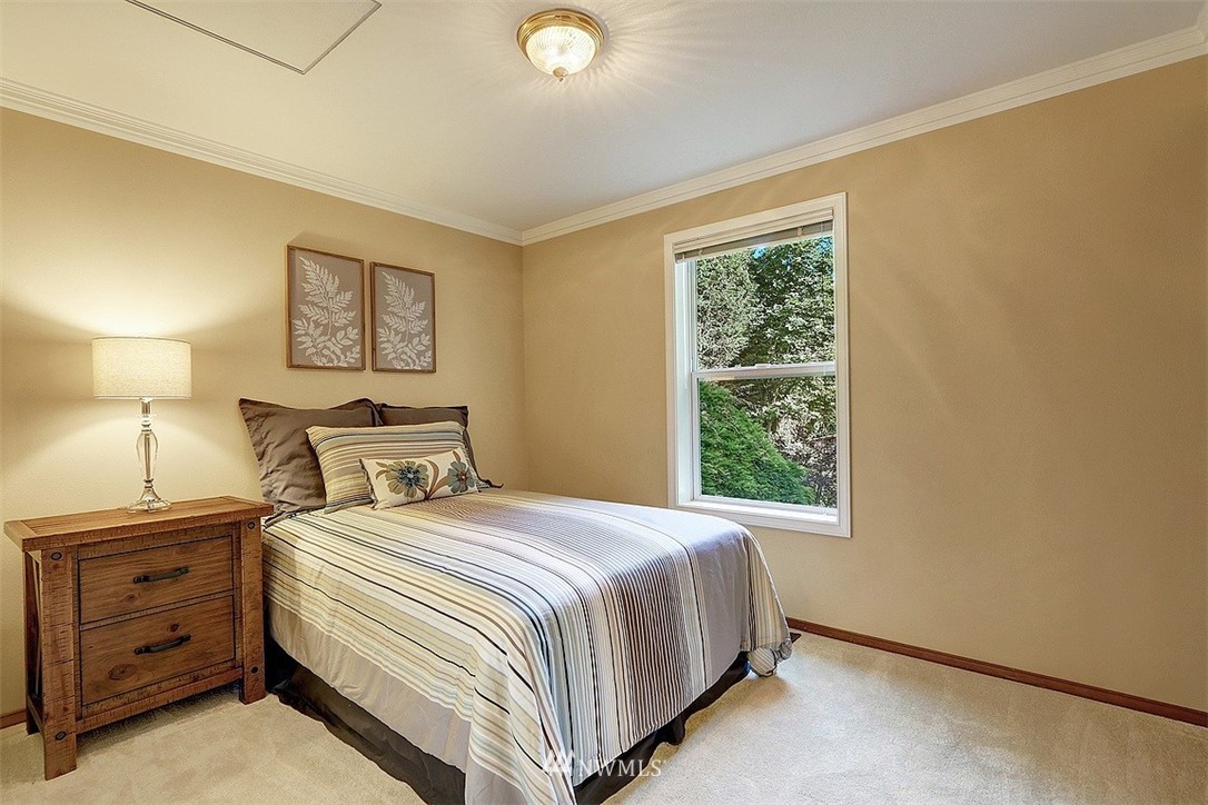 220 174th Street Southwest Bothell, WA 98012 - Photo 19 of 35 a bedroom with a bed and a window