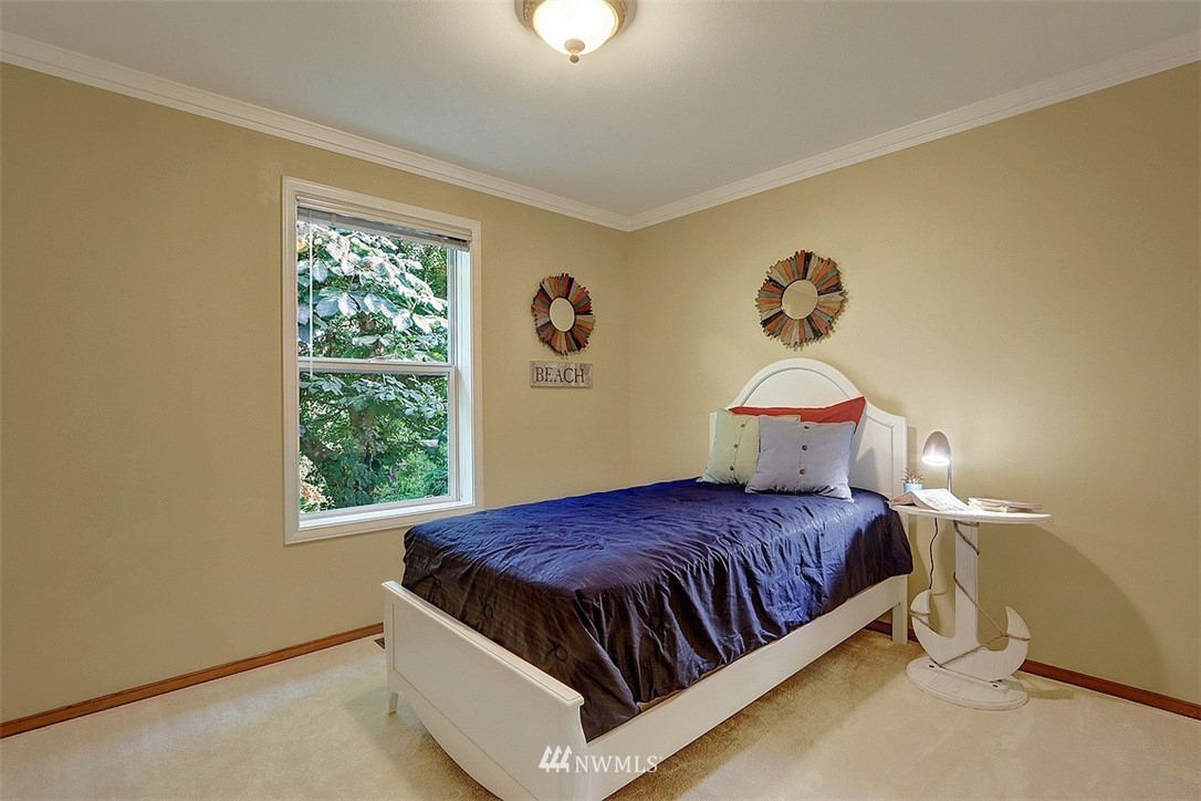 220 174th Street Southwest Bothell, WA 98012 - Photo 20 of 35 a bedroom with a bed and a window