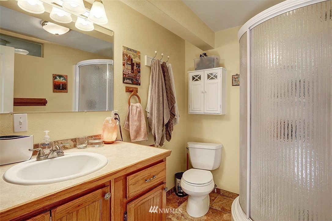 220 174th Street Southwest Bothell, WA 98012 - Photo 28 of 35 a bathroom with a toilet sink and mirror