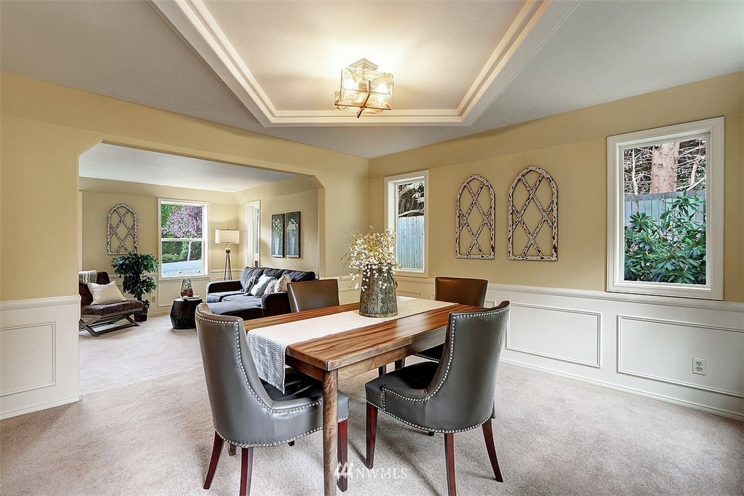 220 174th Street Southwest Bothell, WA 98012 - Photo 10 of 35 a view of a dining room with furniture window and wooden floor