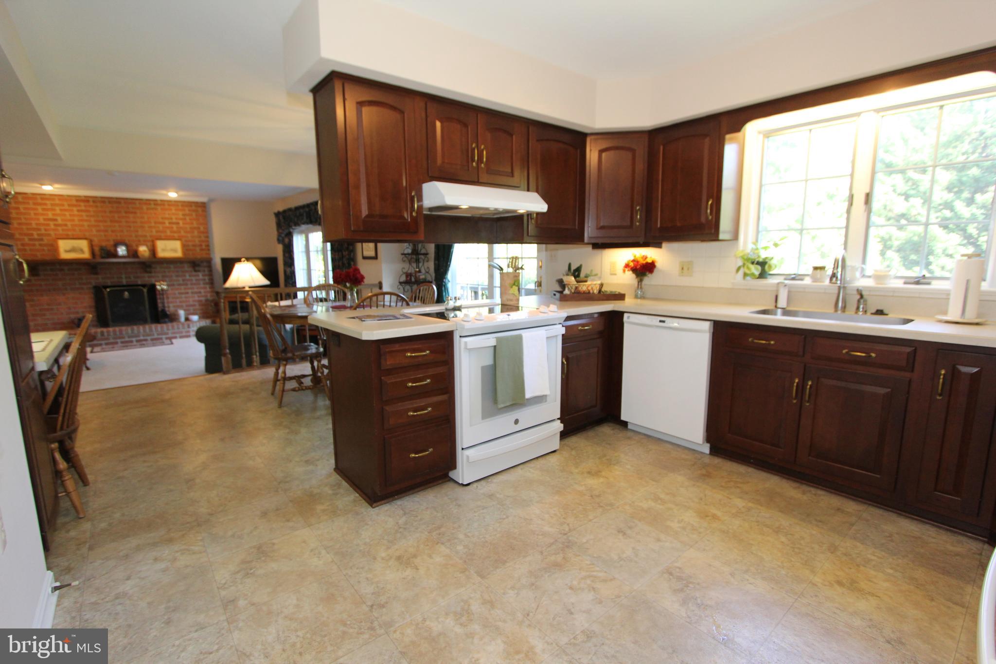 6670 Springhill Drive Frederick, MD 21702 - Photo 11 of 98 a kitchen with kitchen island granite countertop a sink counter top space and stainless steel appliances