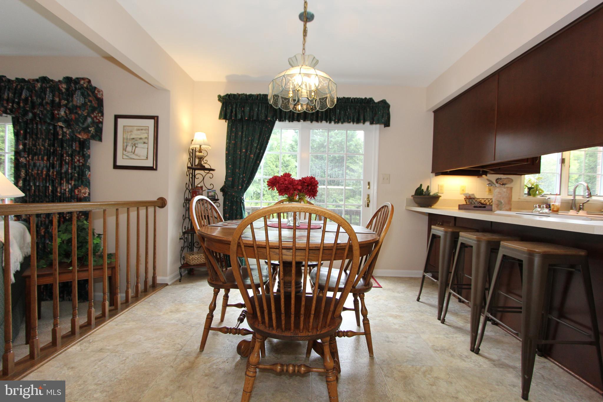 6670 Springhill Drive Frederick, MD 21702 - Photo 16 of 98 a dining room with furniture window and wooden floor