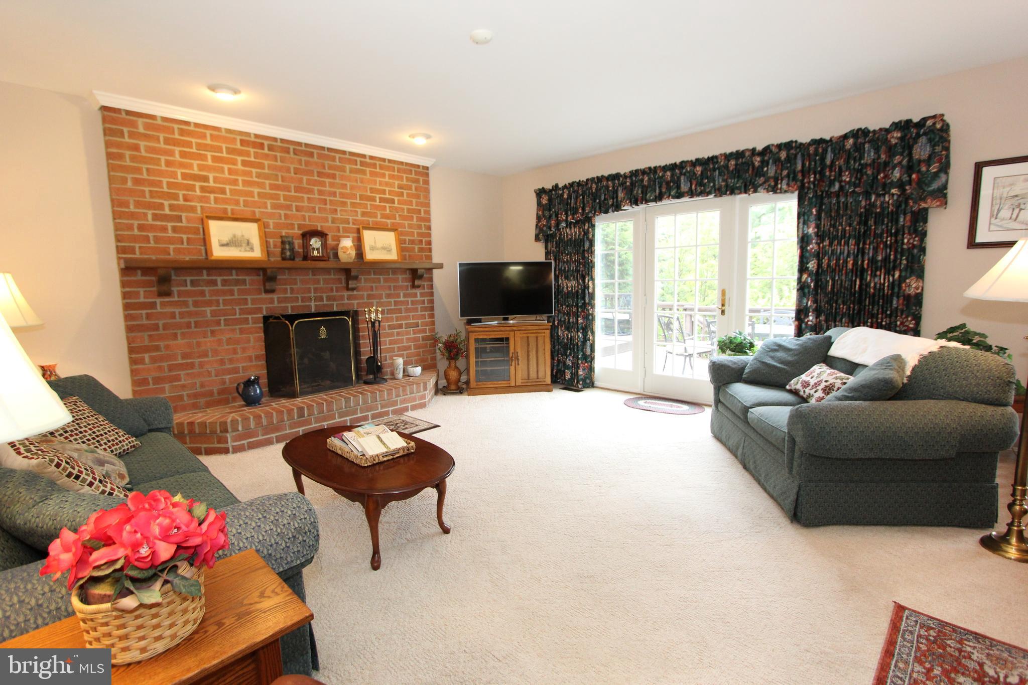 6670 Springhill Drive Frederick, MD 21702 - Photo 23 of 98 a living room with furniture fireplace and window