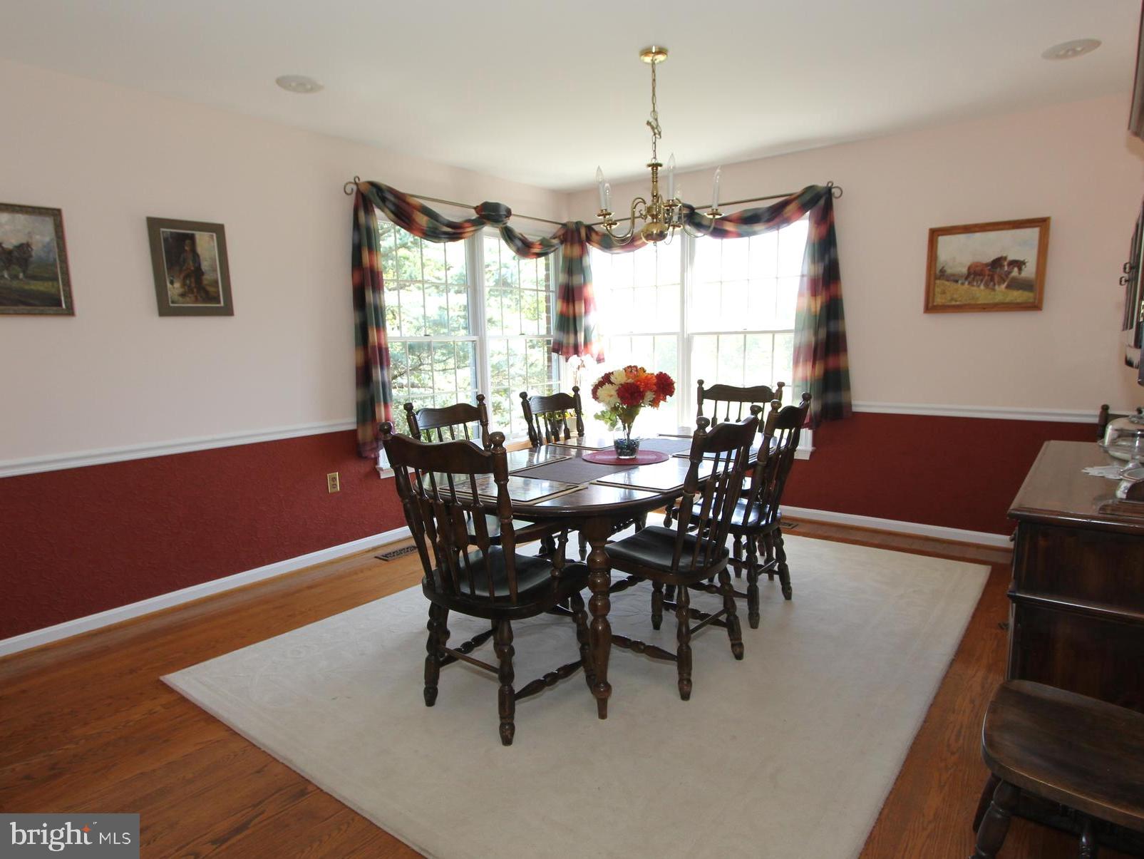 6670 Springhill Drive Frederick, MD 21702 - Photo 25 of 98 a view of a dining room with furniture window and wooden floor