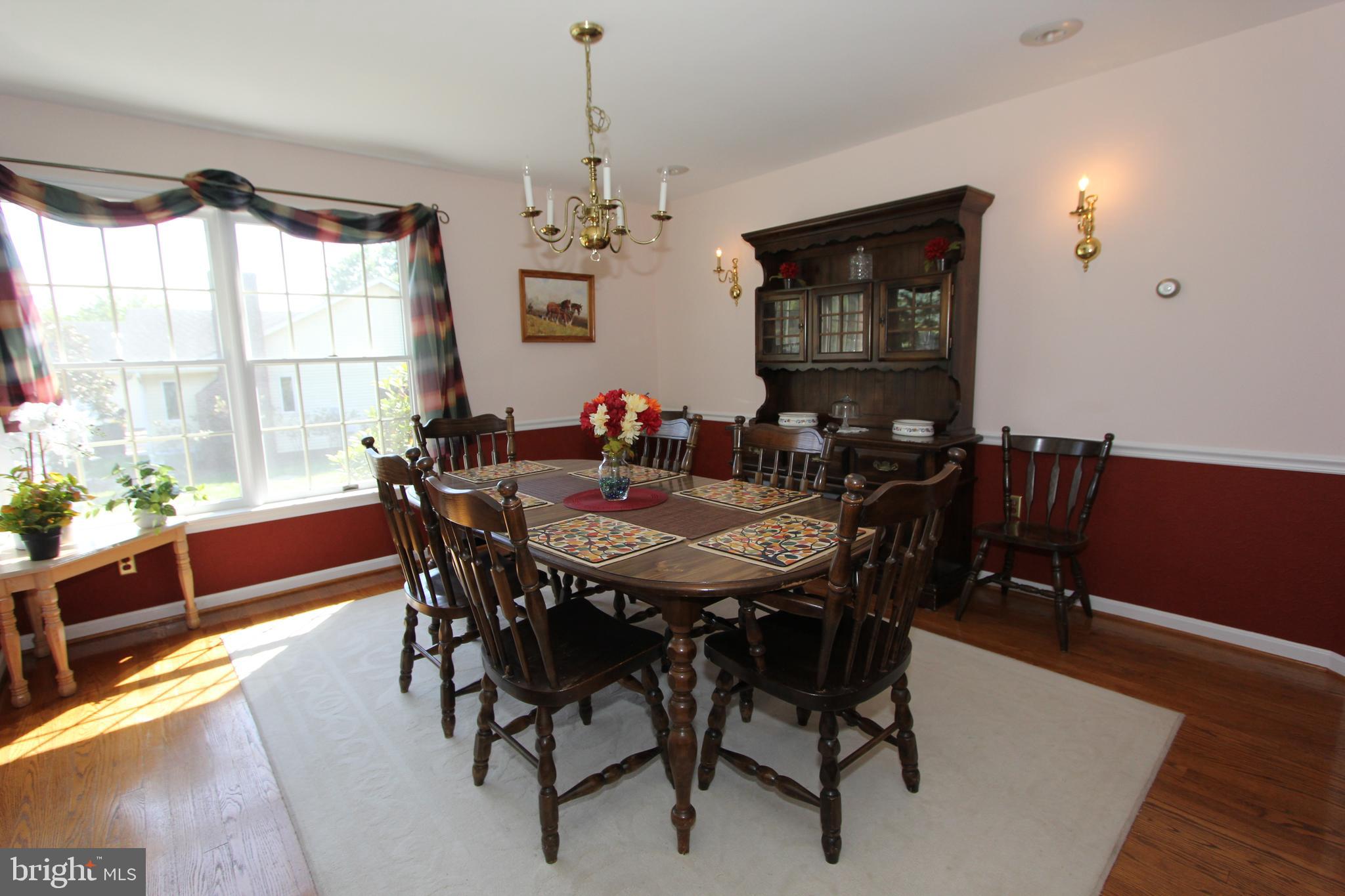 6670 Springhill Drive Frederick, MD 21702 - Photo 26 of 98 a view of a dining room with furniture window and wooden floor