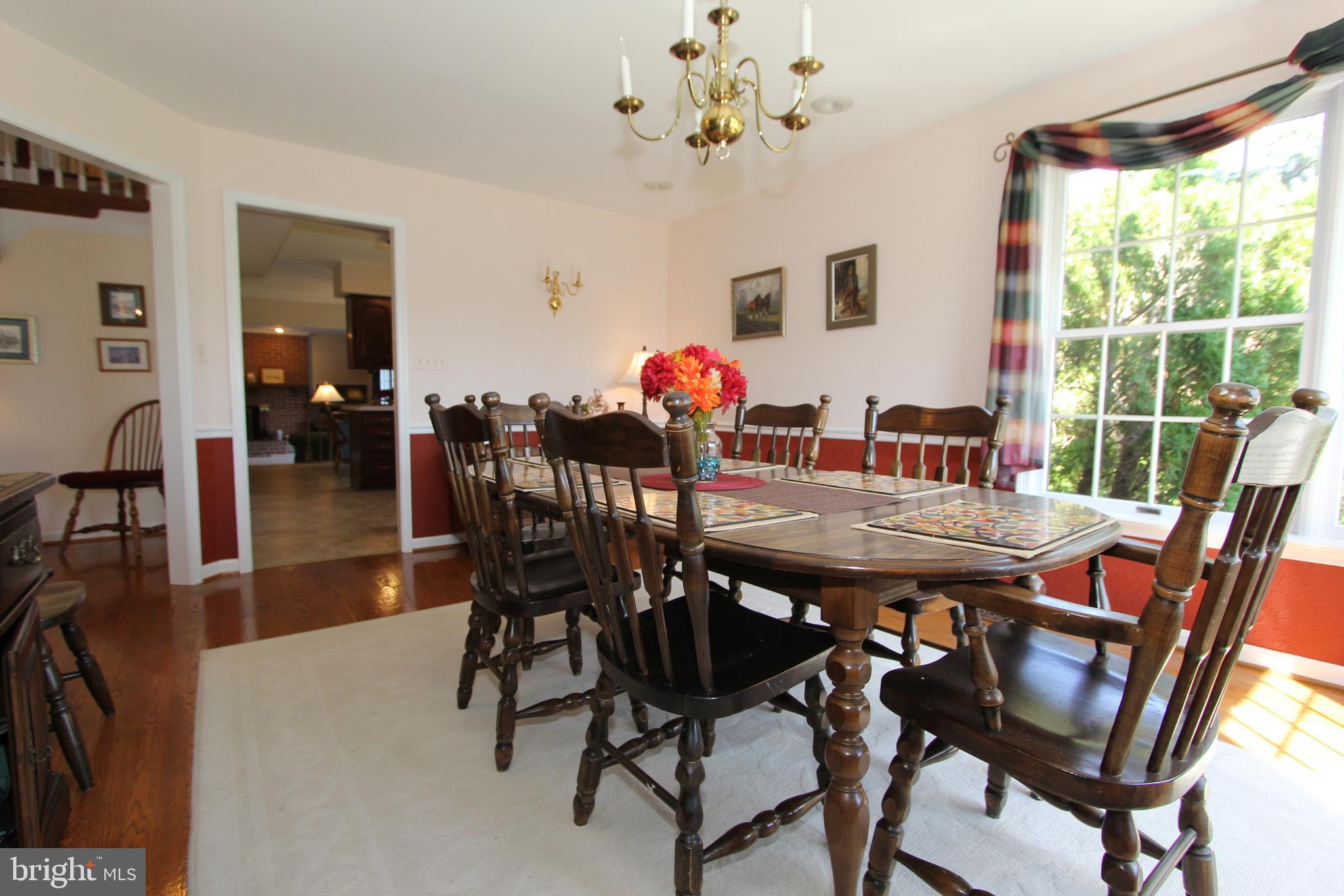 6670 Springhill Drive Frederick, MD 21702 - Photo 27 of 98 a view of a dining room with furniture window and outside view