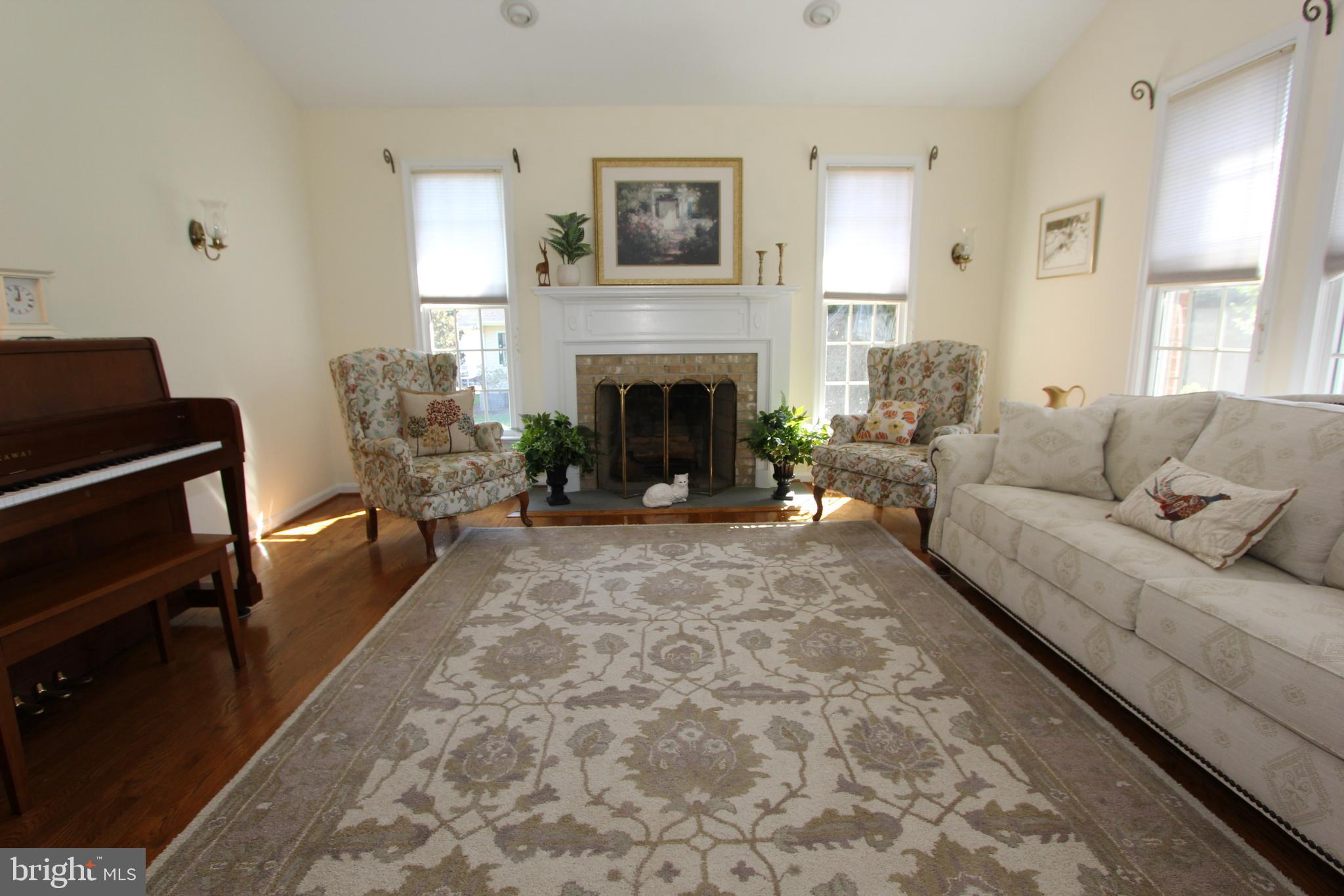 6670 Springhill Drive Frederick, MD 21702 - Photo 28 of 98 a living room with furniture and a fireplace