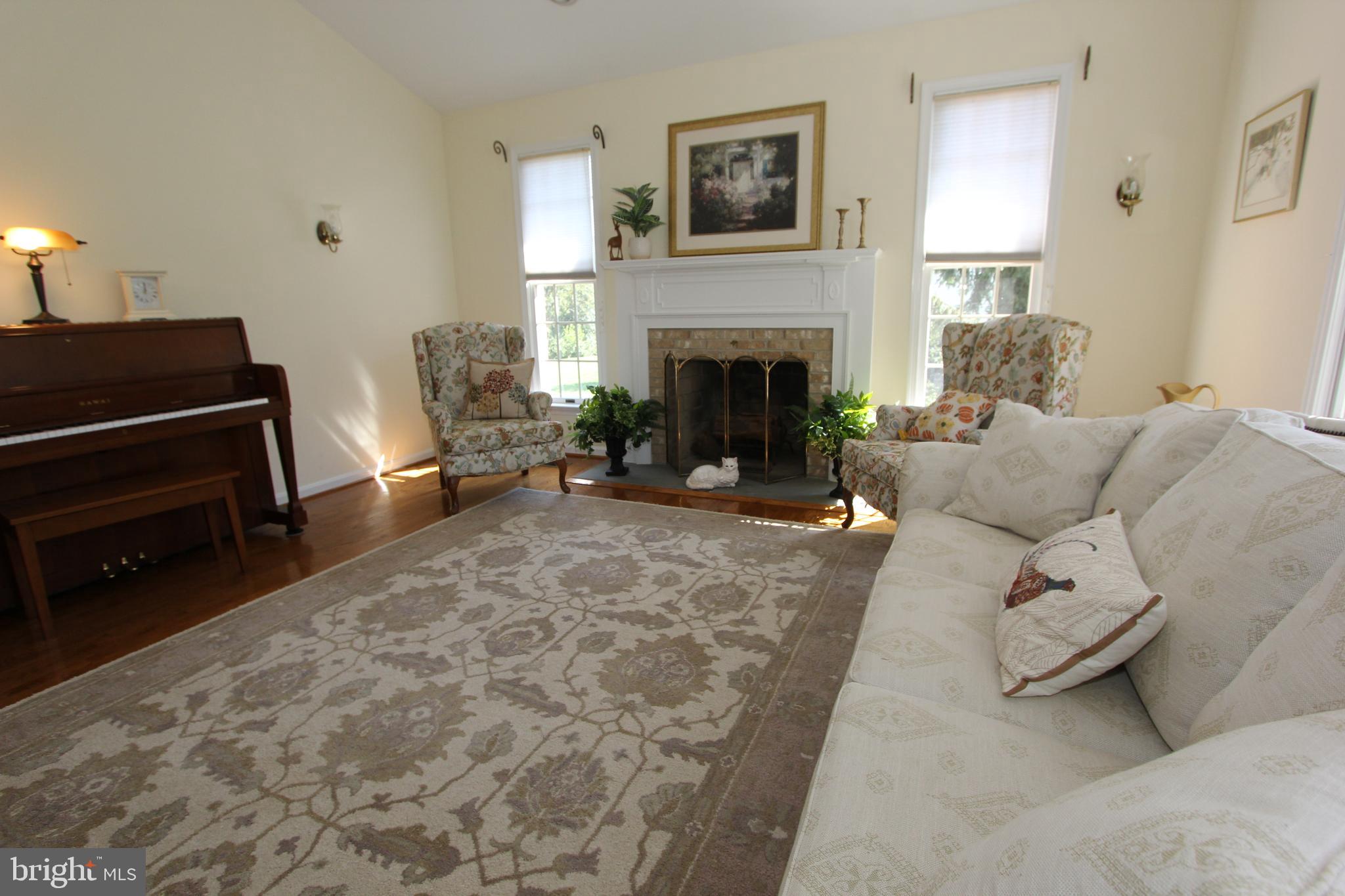6670 Springhill Drive Frederick, MD 21702 - Photo 30 of 98 a living room with furniture and a fireplace