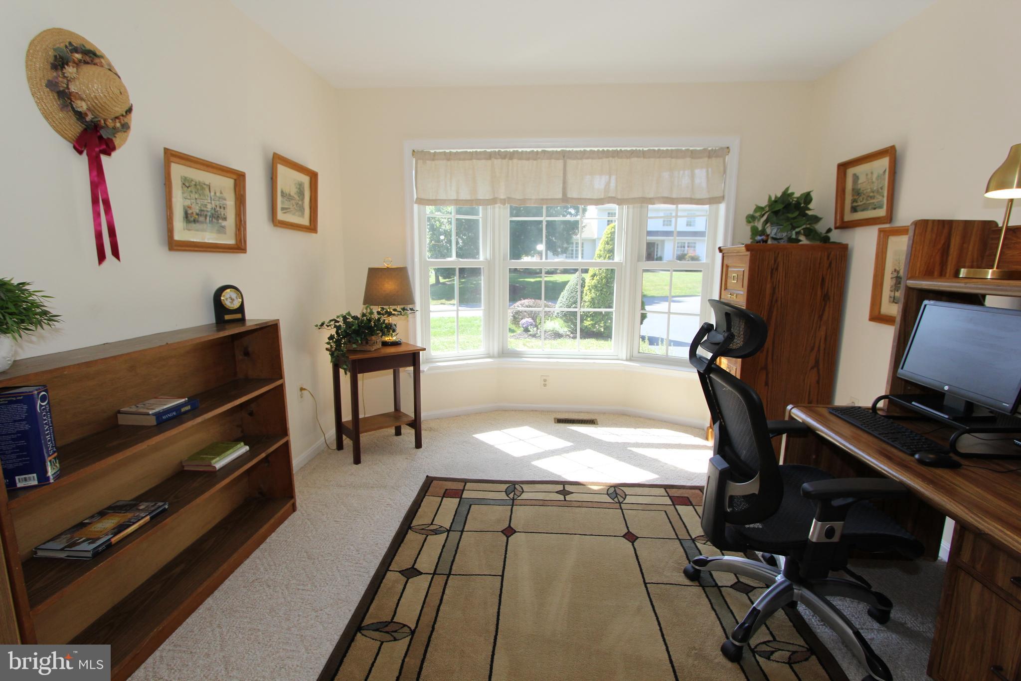 6670 Springhill Drive Frederick, MD 21702 - Photo 32 of 98 a room with gym equipment and a large window
