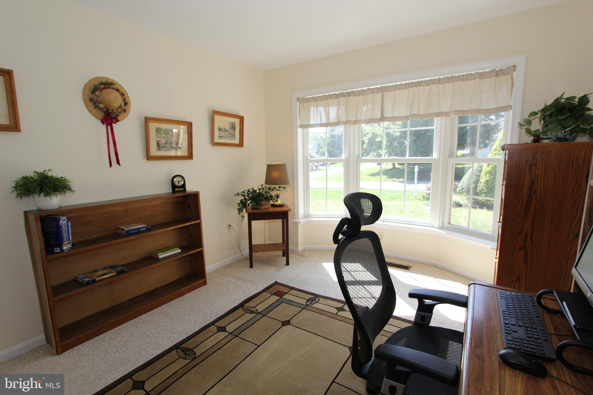 6670 Springhill Drive Frederick, MD 21702 - Photo 33 of 98 a living room with furniture and a window