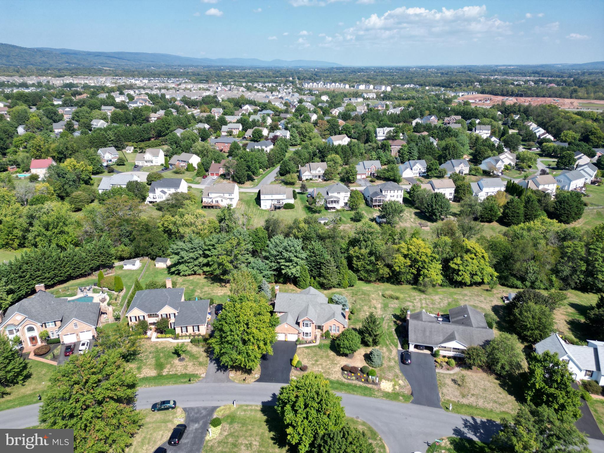 6670 Springhill Drive Frederick, MD 21702 - Photo 4 of 98 an aerial view of a city with lots of residential buildings ocean and mountain view in back