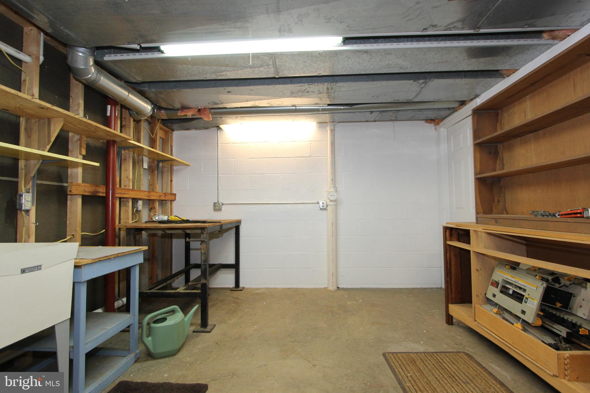 6670 Springhill Drive Frederick, MD 21702 - Photo 57 of 98 Lower level workshop with utility sink