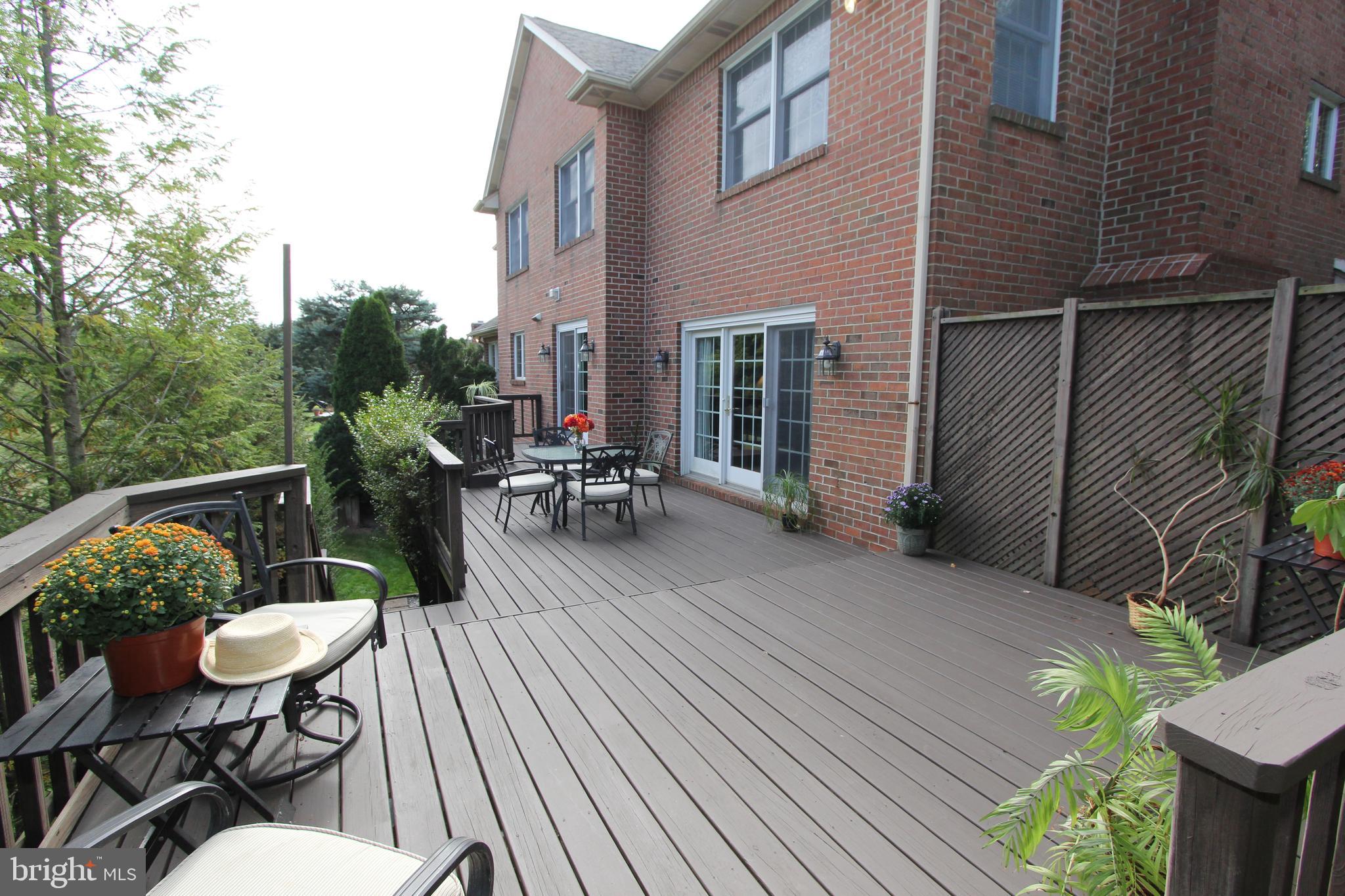 6670 Springhill Drive Frederick, MD 21702 - Photo 66 of 98 a view of a patio with table and chairs with wooden floor and fence