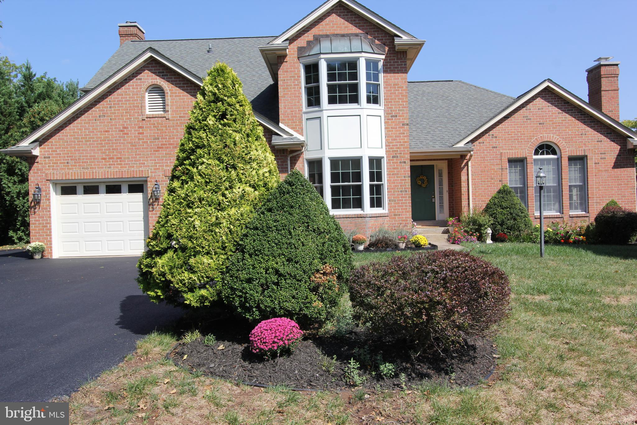 6670 Springhill Drive Frederick, MD 21702 - Photo 75 of 98 a front view of a house with a yard