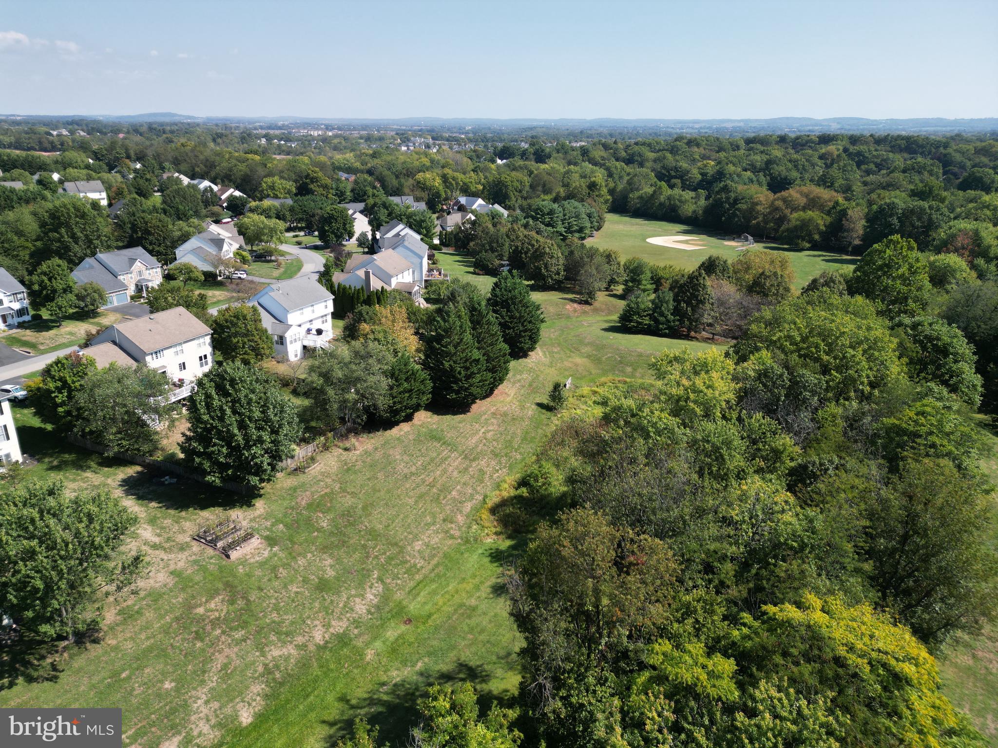 6670 Springhill Drive Frederick, MD 21702 - Photo 82 of 98 an aerial view of a houses with a yard