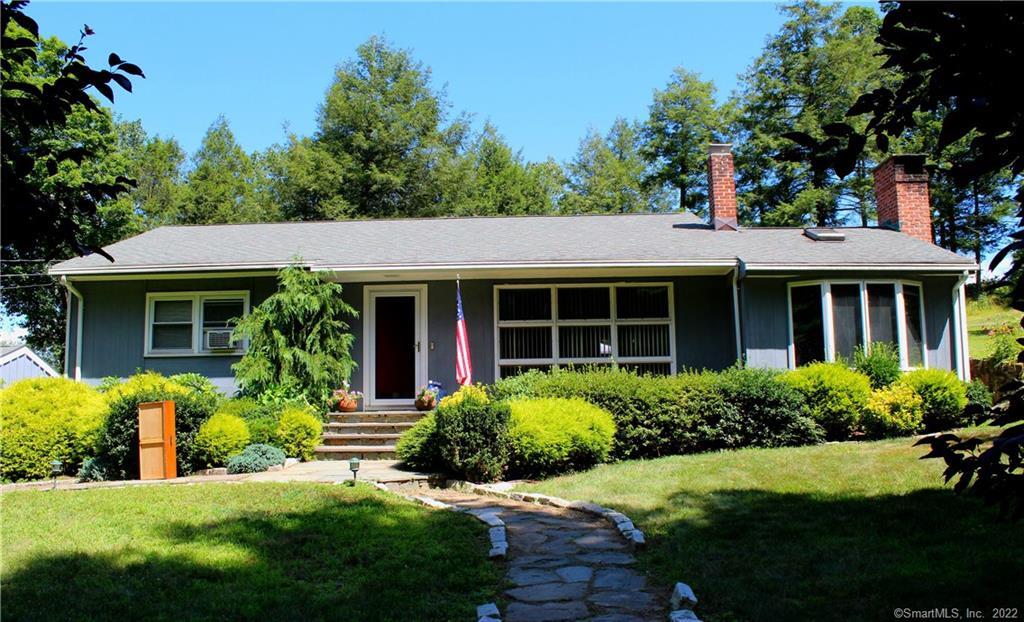20 Sunset Hill Road Wilton, CT 06897 - Photo 1 of 1 a front view of a house with a yard and porch