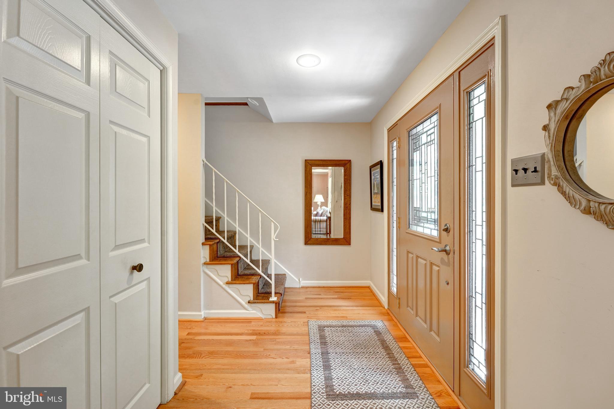 60 East Clearfield Road Havertown, PA 19083 - Photo 12 of 57 a view of a hallway with wooden floor and staircase