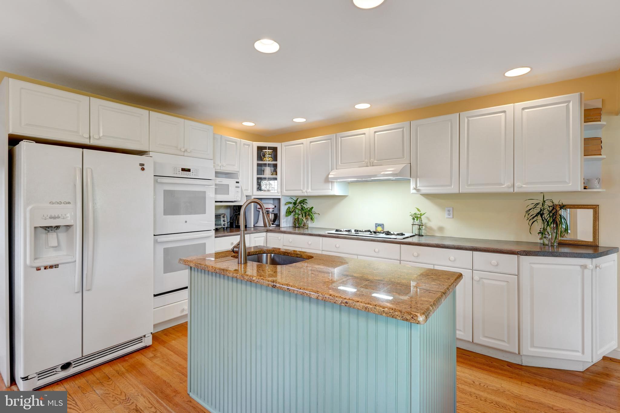 60 East Clearfield Road Havertown, PA 19083 - Photo 17 of 57 a kitchen with stainless steel appliances granite countertop a refrigerator a sink and white cabinets