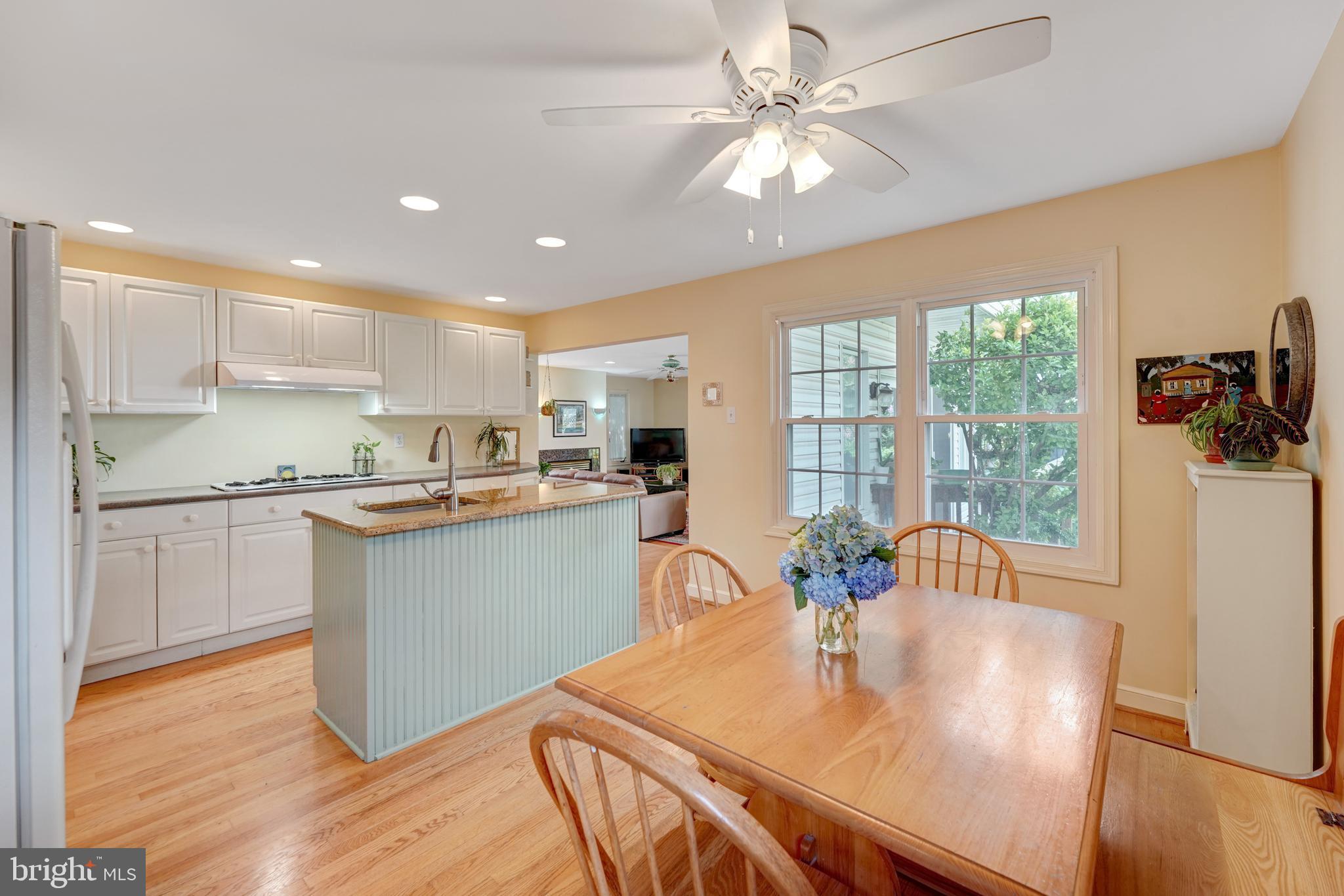 60 East Clearfield Road Havertown, PA 19083 - Photo 18 of 57 a kitchen with a table chairs refrigerator and microwave