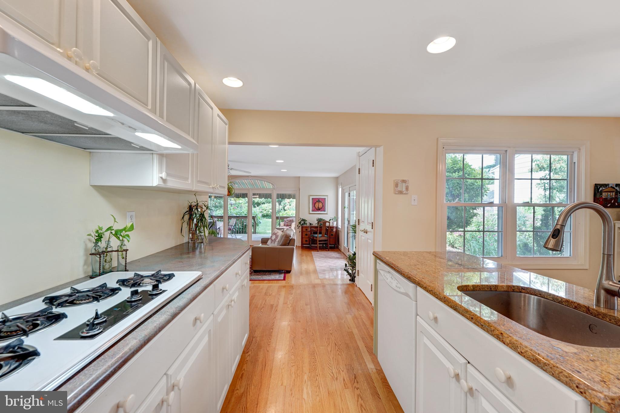 60 East Clearfield Road Havertown, PA 19083 - Photo 19 of 57 a kitchen with stove and wooden floor