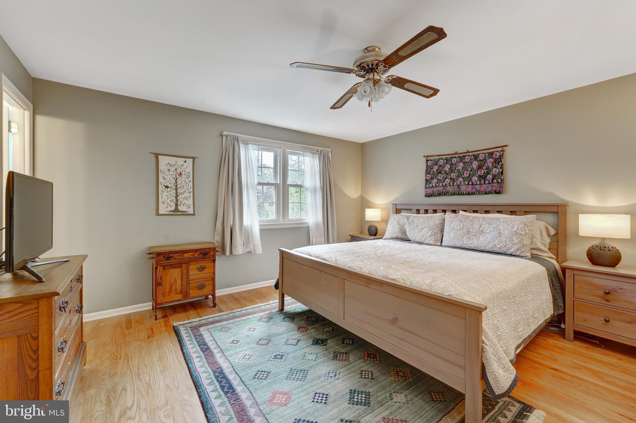 60 East Clearfield Road Havertown, PA 19083 - Photo 22 of 57 a bedroom with a bed and wooden floor