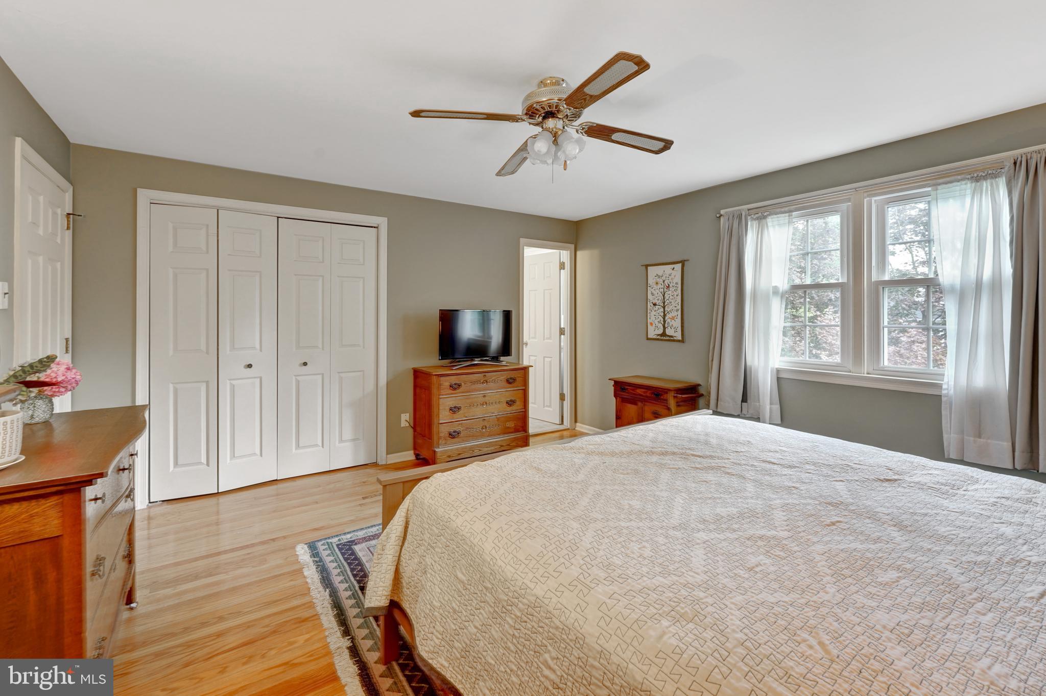 60 East Clearfield Road Havertown, PA 19083 - Photo 23 of 57 a bed room with a bed and a chandelier