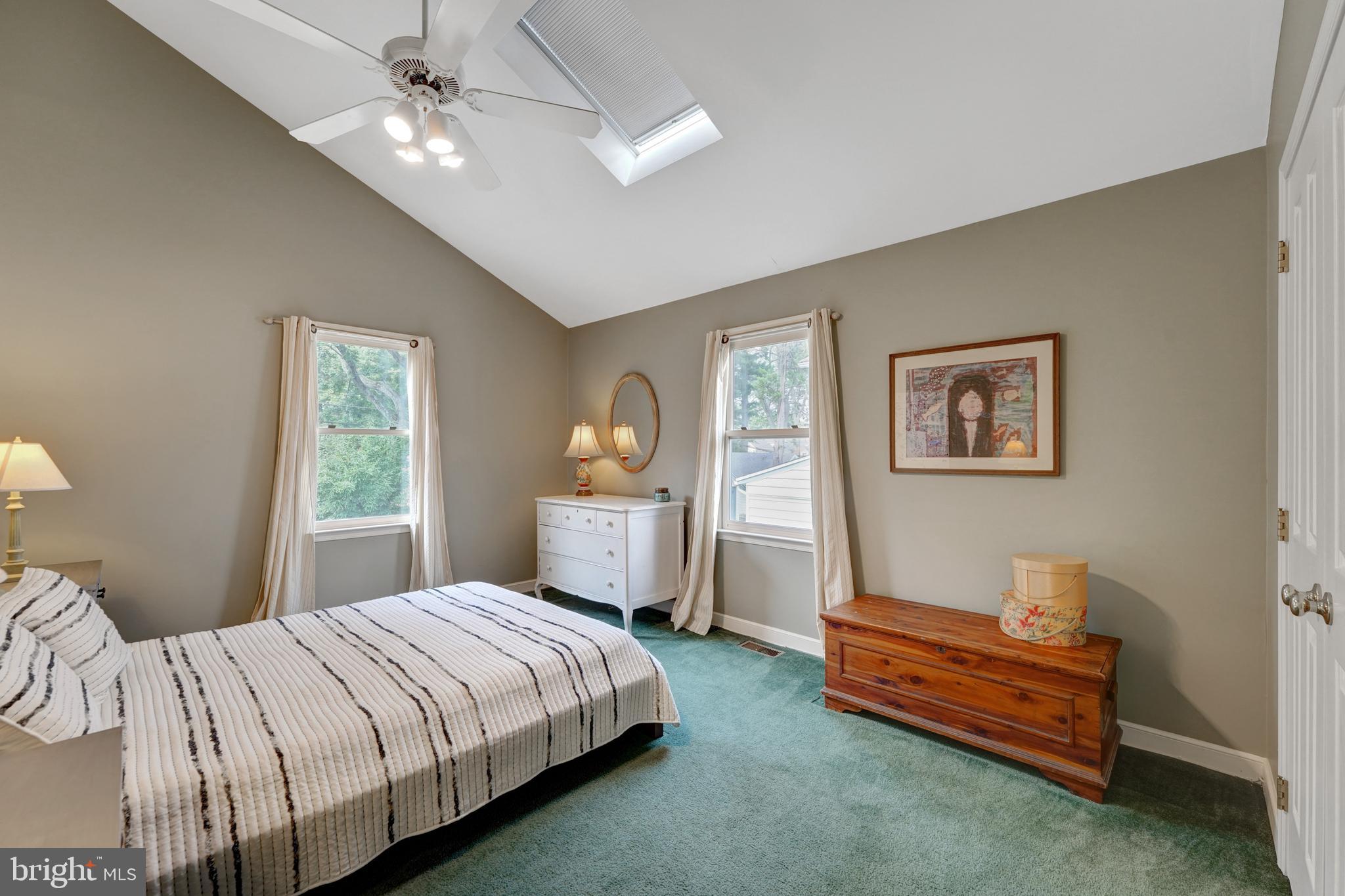 60 East Clearfield Road Havertown, PA 19083 - Photo 29 of 57 a bedroom with a bed and a chandelier