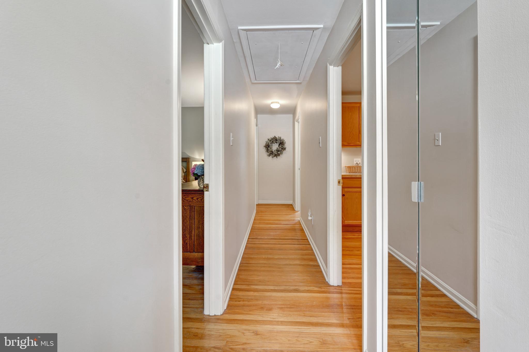 60 East Clearfield Road Havertown, PA 19083 - Photo 32 of 57 a view of a hallway with wooden floor and glass doors