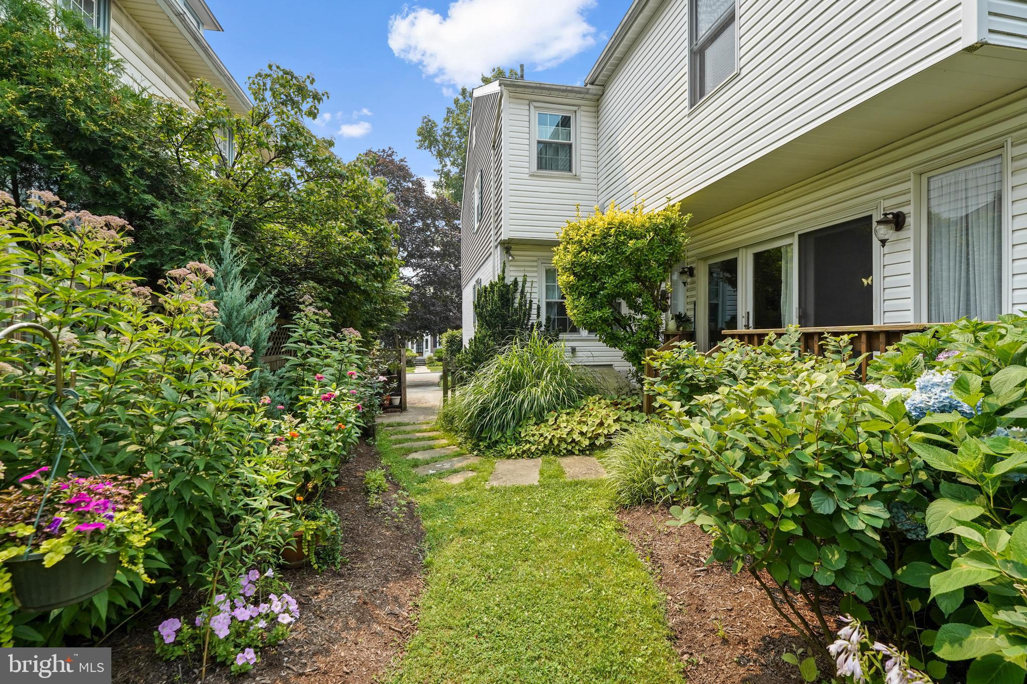 60 East Clearfield Road Havertown, PA 19083 - Photo 51 of 57 a view of a house with a flower garden