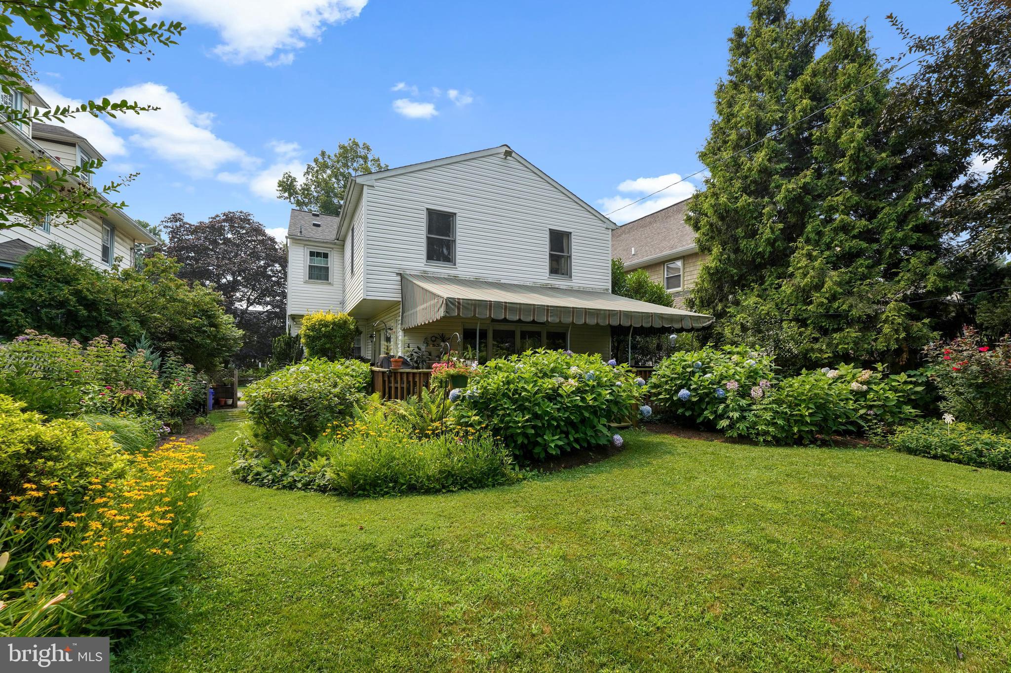 60 East Clearfield Road Havertown, PA 19083 - Photo 53 of 57 a front view of a house with a yard
