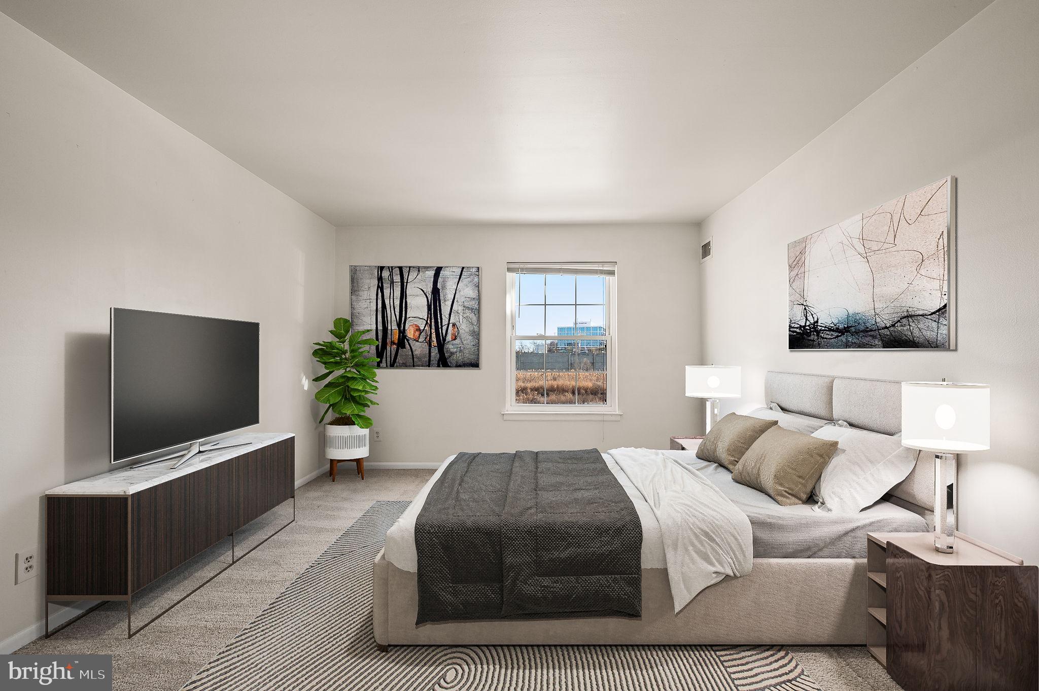 401 Drummers Lane Wayne, PA 19087 - Photo 14 of 21 a bedroom with a bed and a flat screen tv