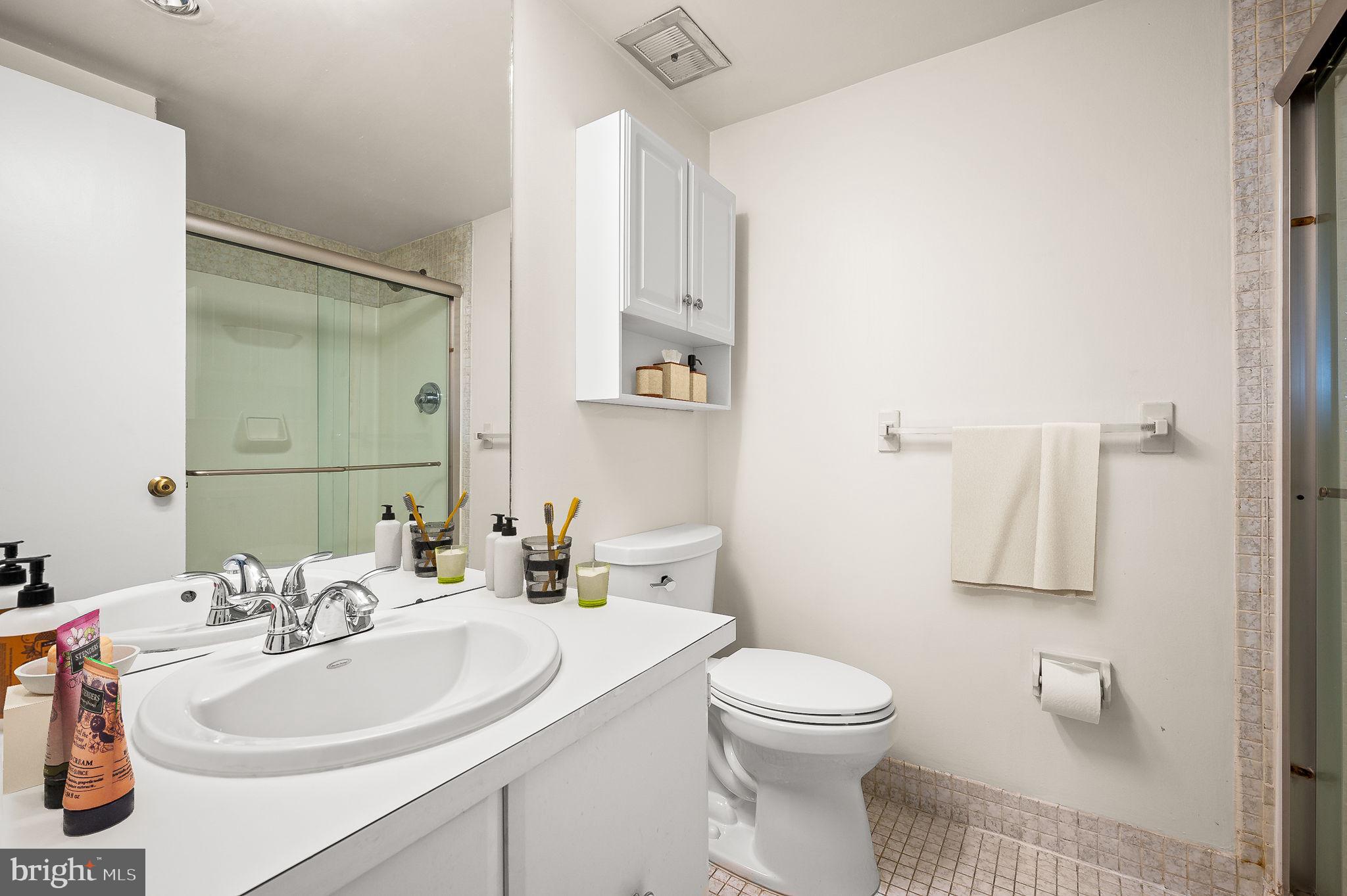 401 Drummers Lane Wayne, PA 19087 - Photo 16 of 21 a bathroom with a sink a toilet and shower