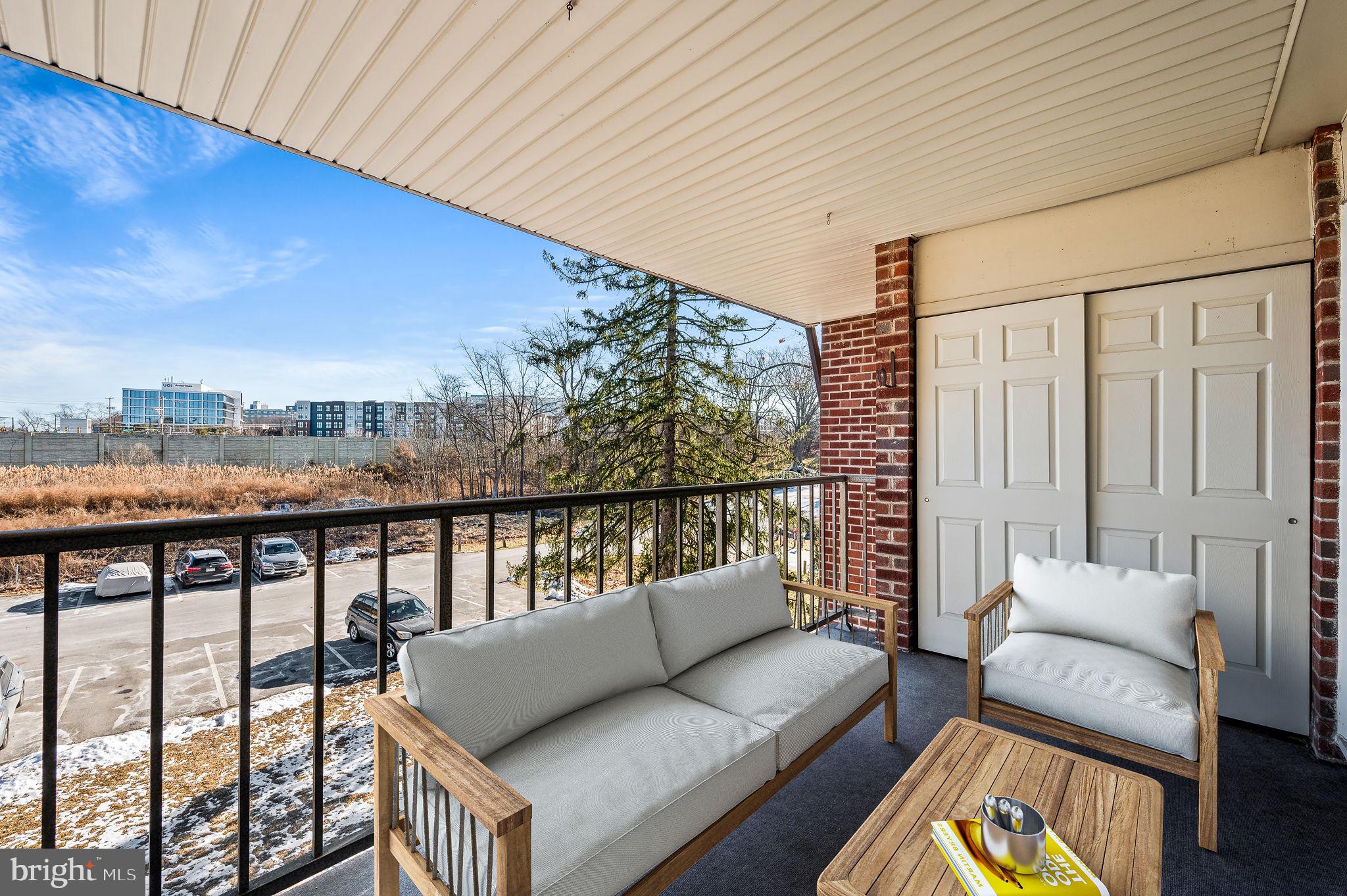 401 Drummers Lane Wayne, PA 19087 - Photo 19 of 21 a balcony with couch and city view