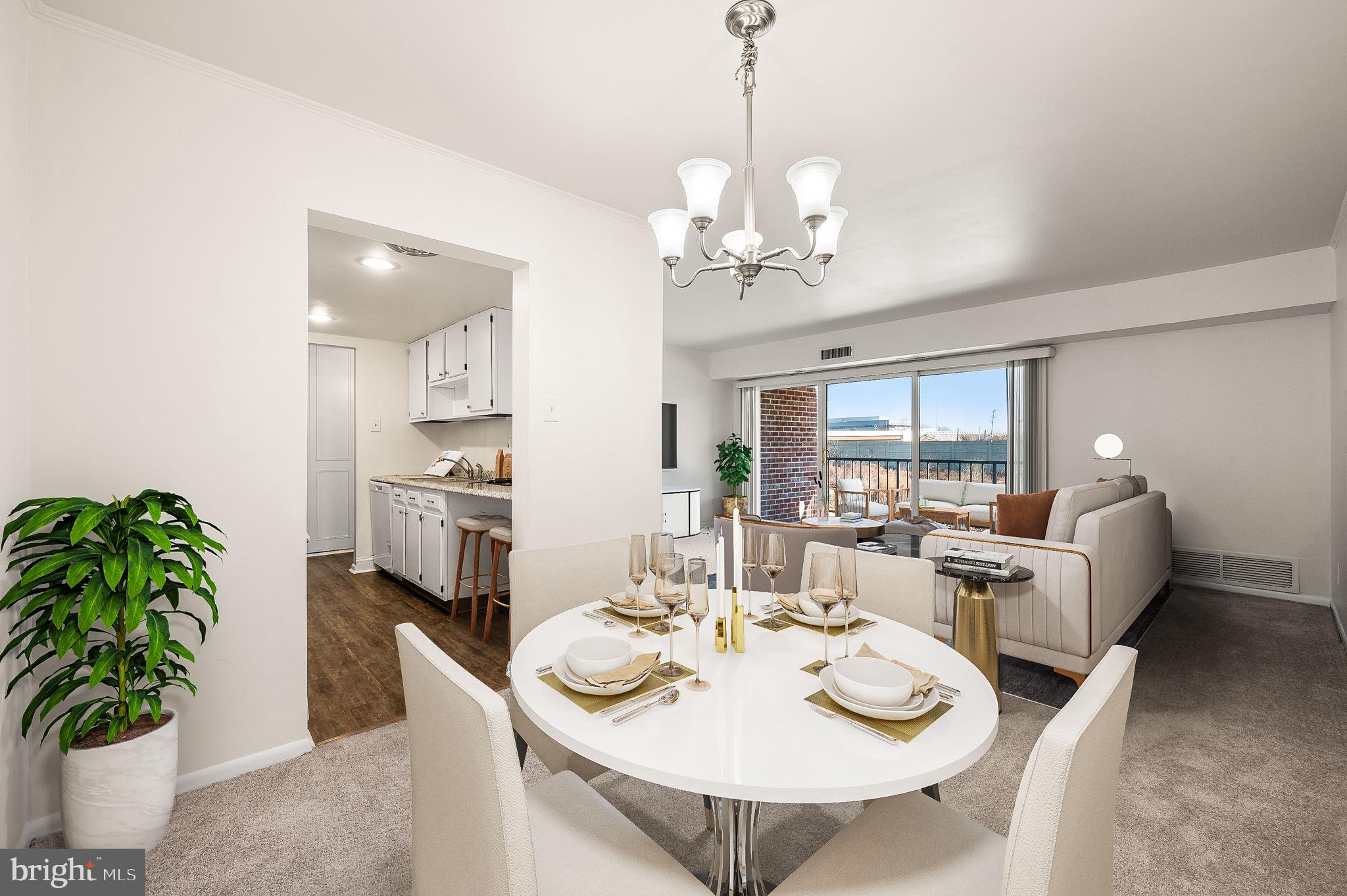 401 Drummers Lane Wayne, PA 19087 - Photo 6 of 21 a view of a dining room with furniture a livingroom and chandelier