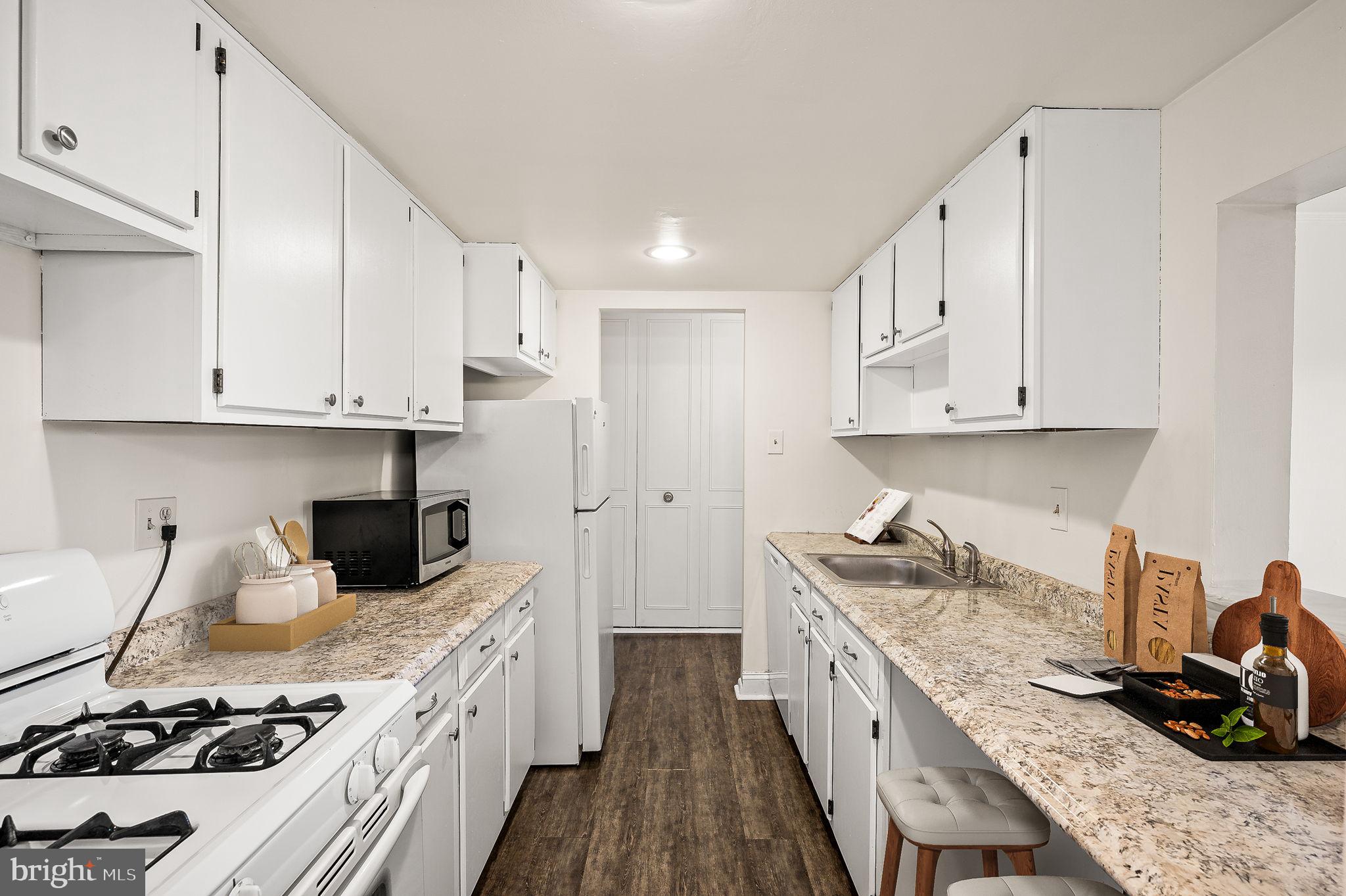 401 Drummers Lane Wayne, PA 19087 - Photo 10 of 21 a kitchen with sink stove and cabinets