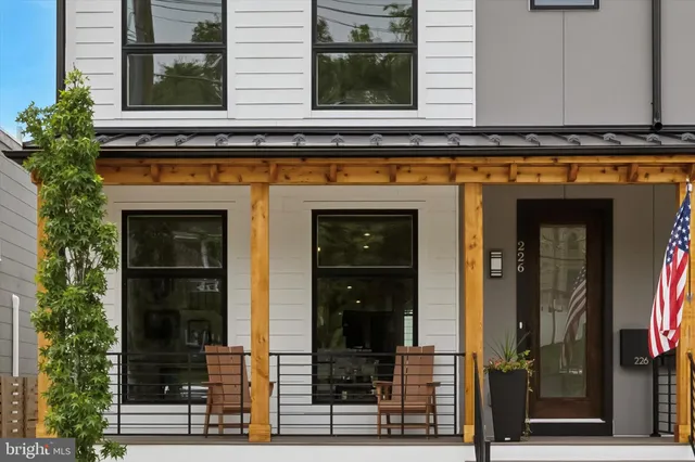 a front view of a house with glass windows