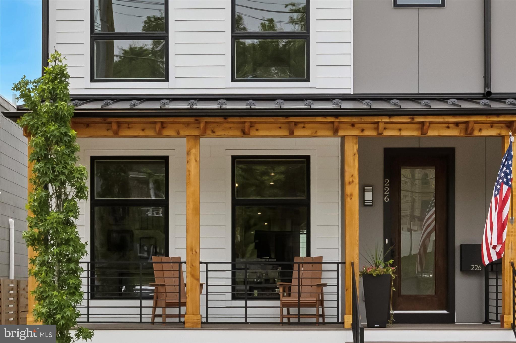 a front view of a house with glass windows