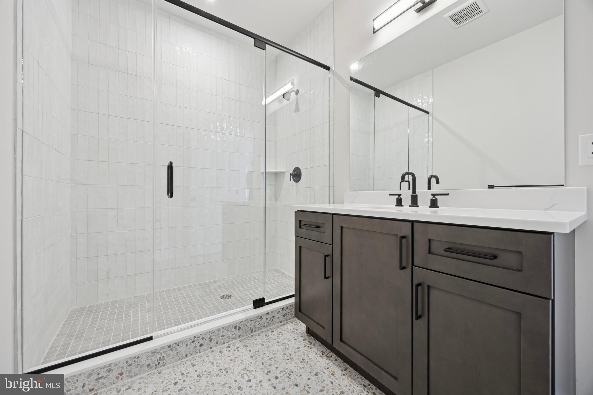 226 North Main Street Doylestown, PA 18901 - Photo 18 of 24 a bathroom with a sink and a mirror