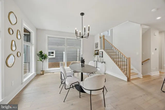 a view of a livingroom with furniture window and wooden floor