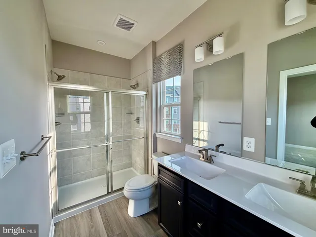 a large kitchen with a large counter top appliances and cabinets
