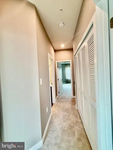 a view of a living room with wooden floor