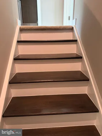 an empty room with windows and entrance