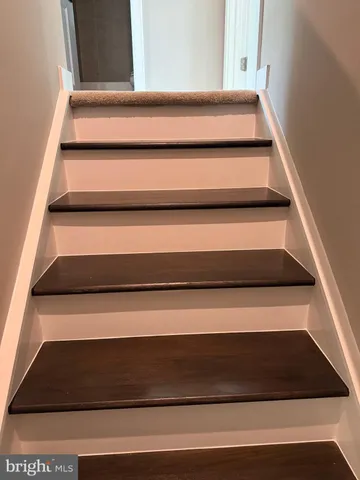 an empty room with windows and entrance