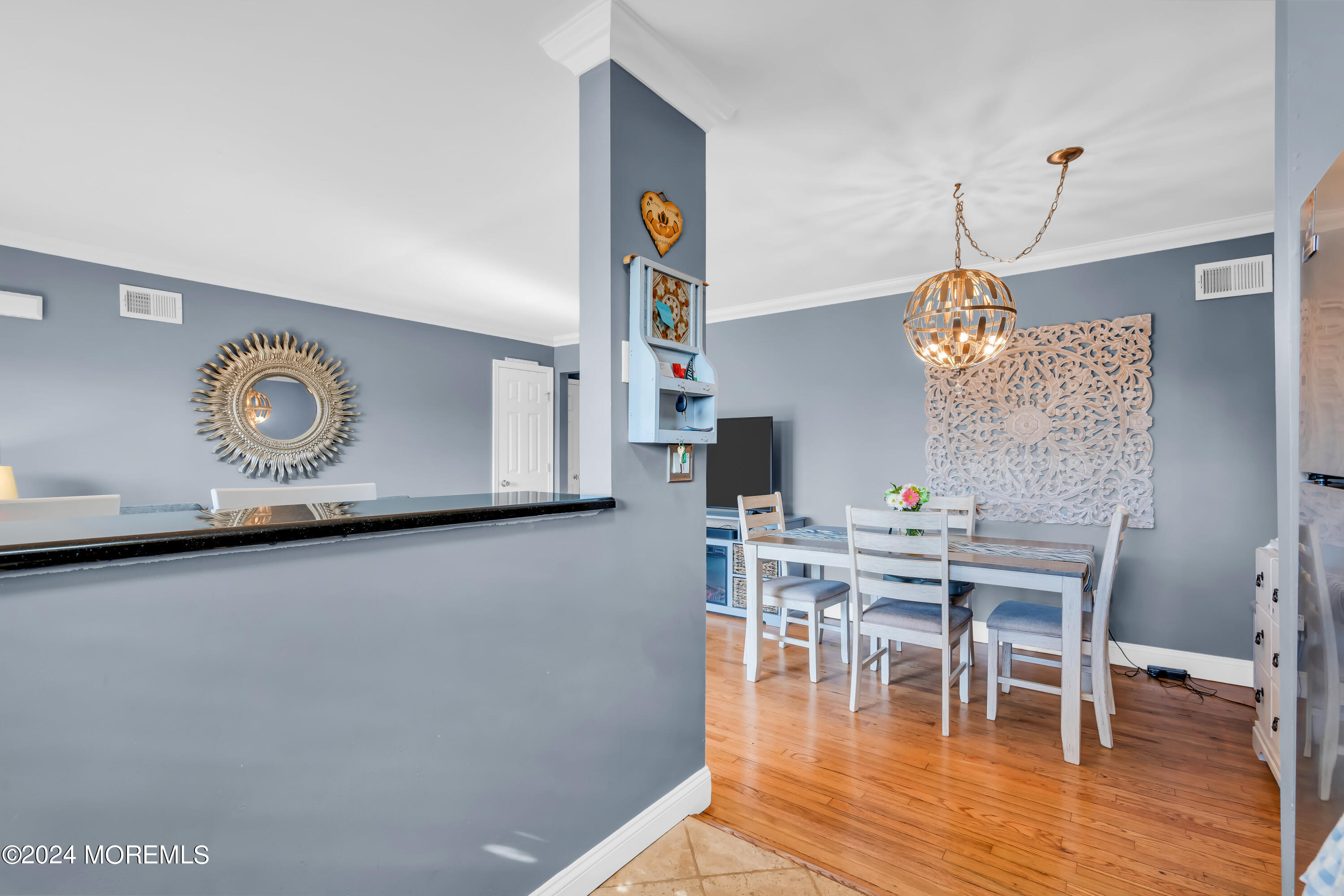 1641 Elm Avenue, Unit 18 Point Pleasant, NJ 08742 - Photo 11 of 23 a view of a dining room with furniture and wooden floor