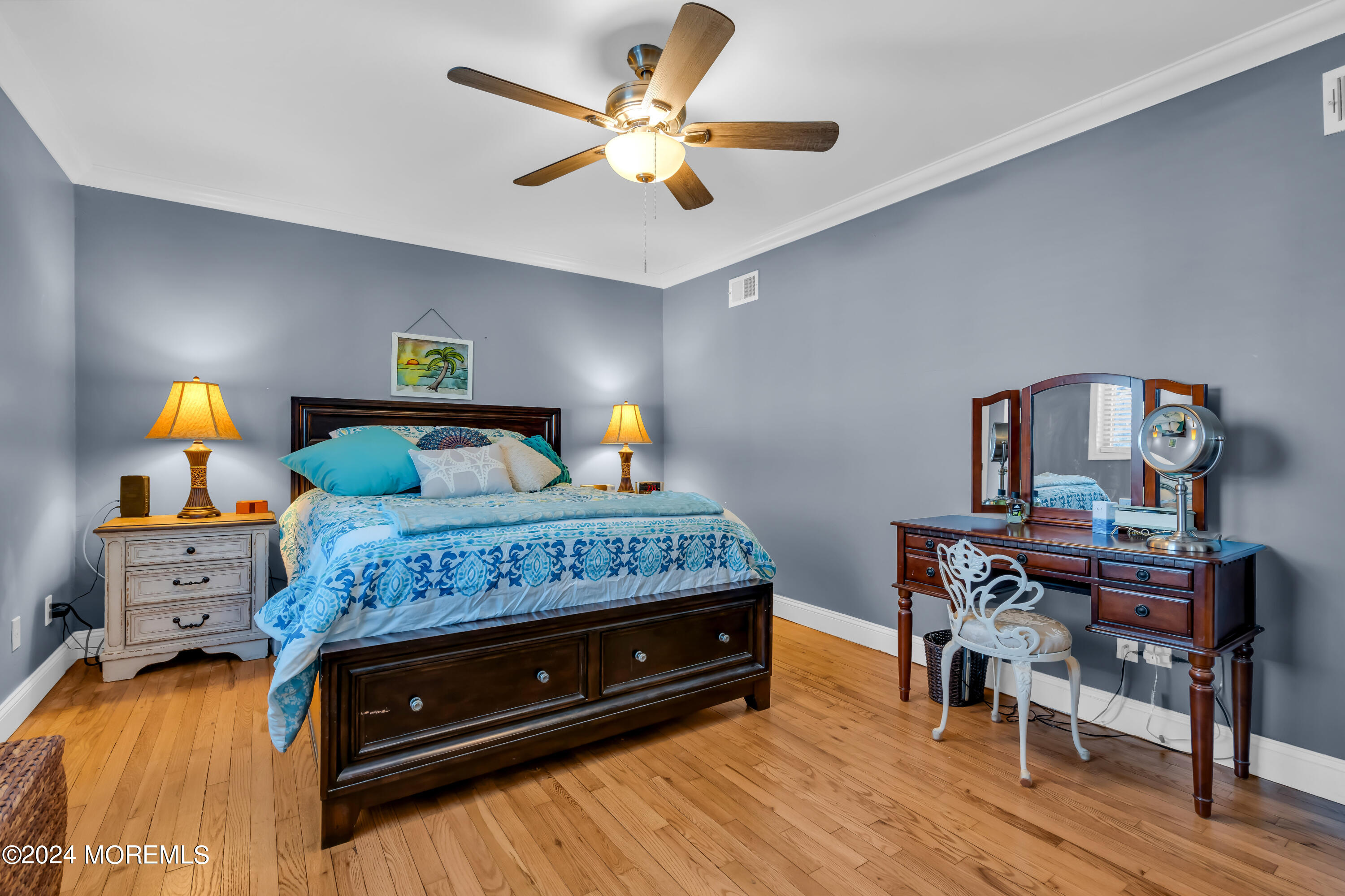 1641 Elm Avenue, Unit 18 Point Pleasant, NJ 08742 - Photo 14 of 23 a bedroom with a bed and a chandelier