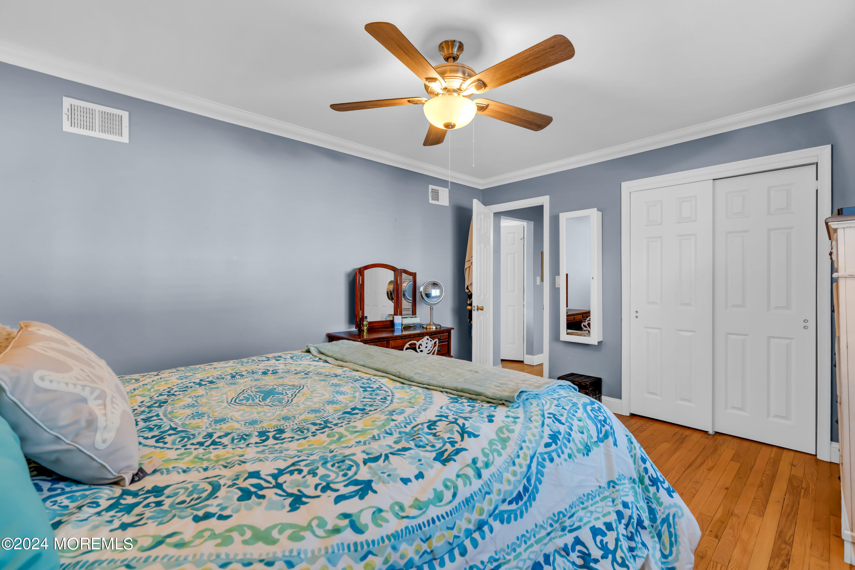 1641 Elm Avenue, Unit 18 Point Pleasant, NJ 08742 - Photo 16 of 23 a bedroom with a bed and a chandelier