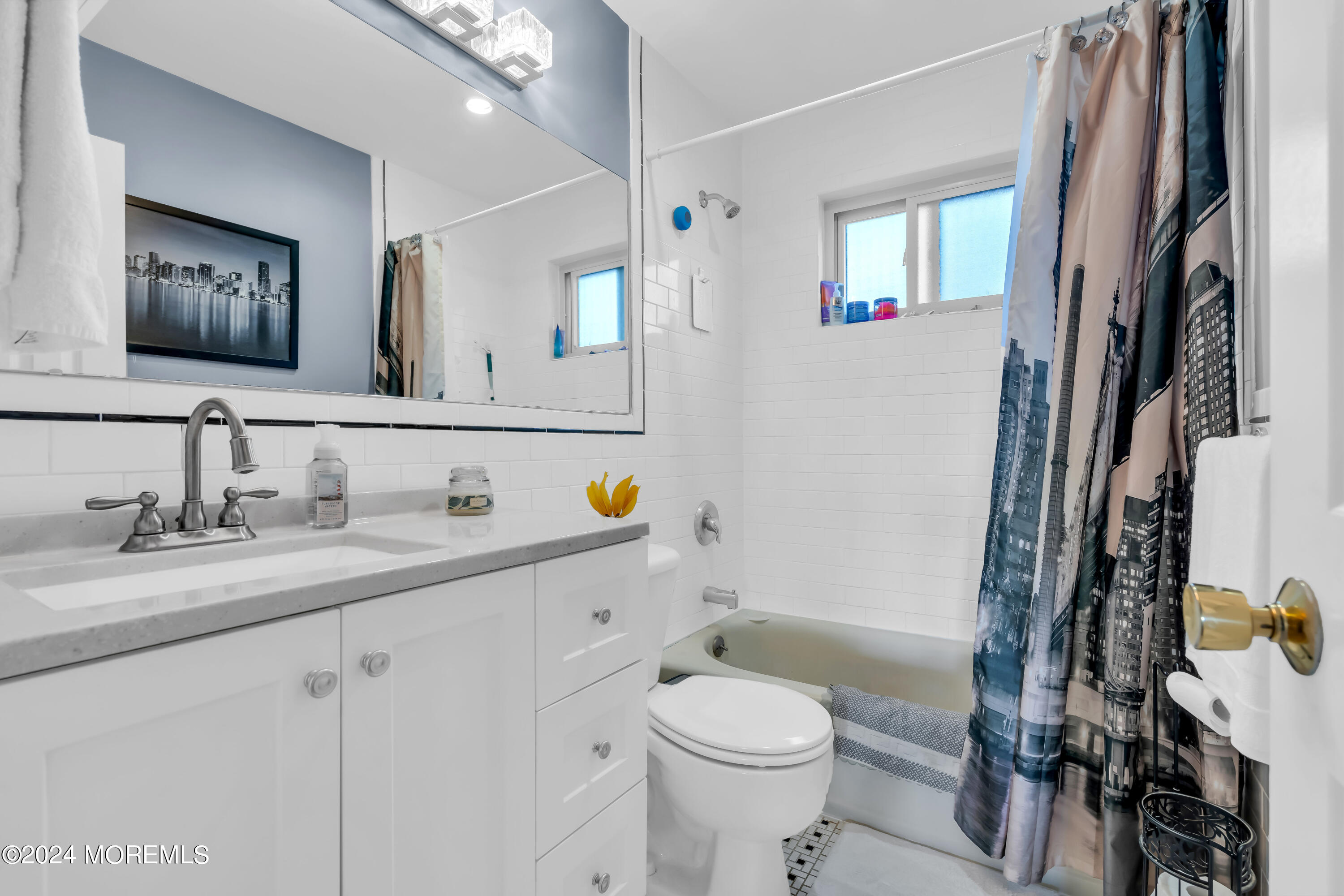 1641 Elm Avenue, Unit 18 Point Pleasant, NJ 08742 - Photo 17 of 23 a bathroom with a granite countertop sink toilet and shower